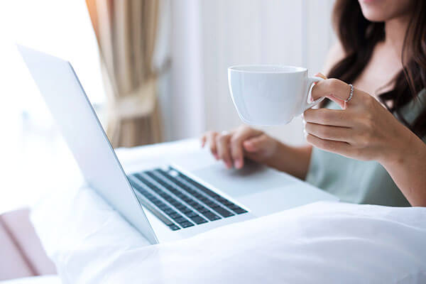 Girl working from her hotel room